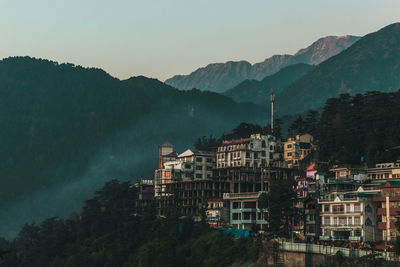High angle view of buildings and mountains against sky