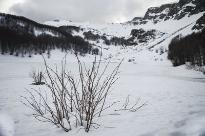 Scenic view of snow covered mountains against sky