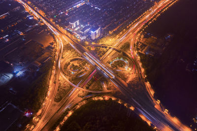 High angle view of light trails on road at night