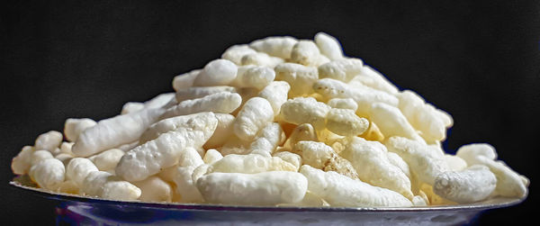 Close-up of ice cream in bowl against black background