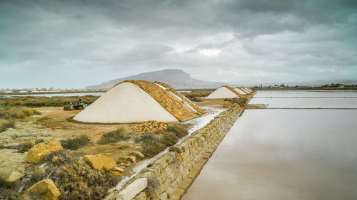 Built structure on shore against sky