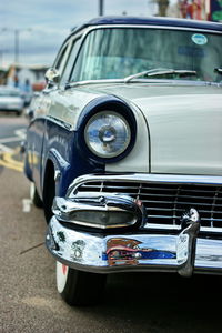 Close-up of vintage car on street