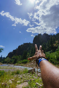 Midsection of man on cliff against mountain