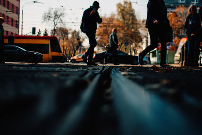 Surface level of people walking on street in city