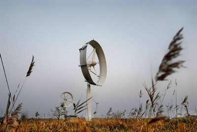 Grass growing on field against clear sky