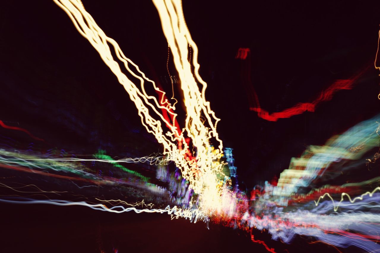 night, long exposure, illuminated, light trail, motion, no people, abstract, outdoors, low angle view, multi colored, speed, close-up, dark, danger, copy space, blurred motion, pattern, nature, red, light painting