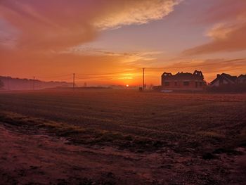 Scenic view of field against sky during sunset