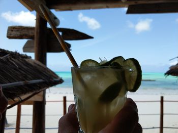 Close-up of hand holding drink