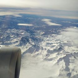 Aerial view of landscape against cloudy sky