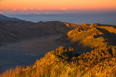 Scenic view of mountains against sky during sunset