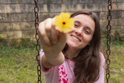 Close-up of woman holding swing