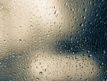 Full frame shot of wet glass window