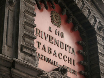 Low angle view of text on building
