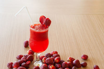 Close-up of strawberries in glass on table