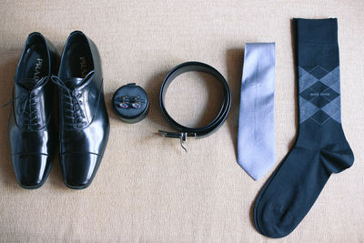 High angle view of shoes on tiled floor