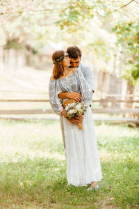 Full length of couple embracing outdoors