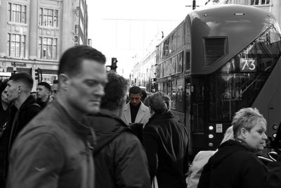 People walking on street in city