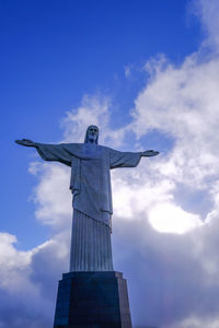 Low angle view of statue against cloudy sky