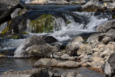 Water flowing through rocks in sea