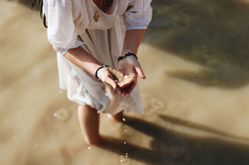 High angle view of woman in shallow water