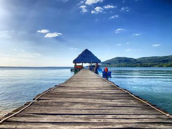 Pier over sea against sky