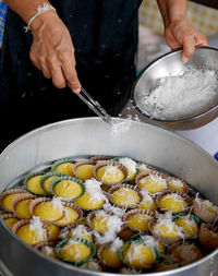 Midsection of man preparing food