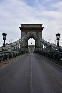 Chain bridge against sky