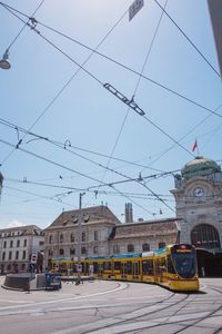 Cars in city against sky