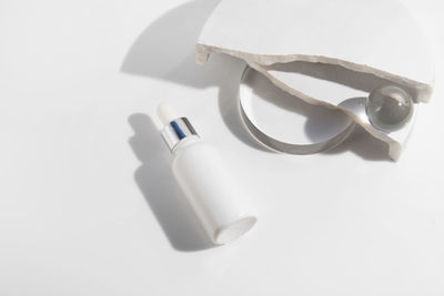 High angle view of pills on white background