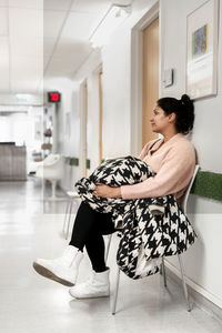 Woman sitting in waiting room