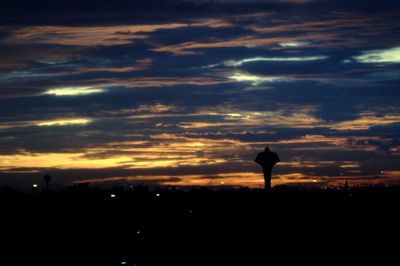Silhouette of landscape against dramatic sky