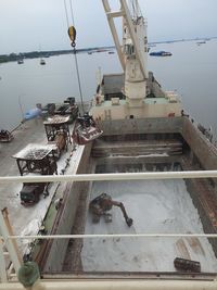 High angle view of ship by sea against sky