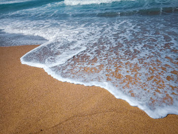 High angle view of surf on beach