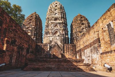 Low angle view of old temple building against sky