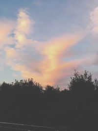 Low angle view of silhouette trees against sky at sunset