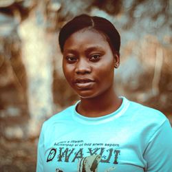 Portrait of teenage girl standing outdoors