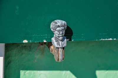 Close-up of metal against blue wall