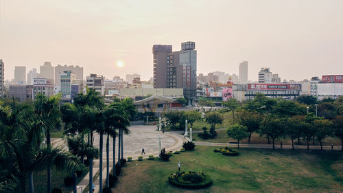 High angle view of trees and buildings against sky