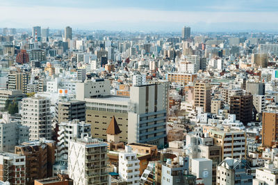 Aerial view of cityscape against sky