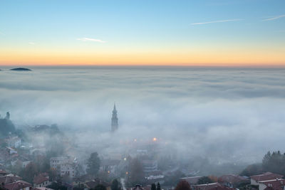 High angle view of city buildings during sunset