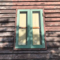 Closed window of wooden house