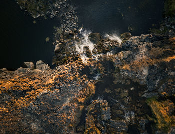 High angle view of rock formation in sea