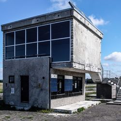 Low angle view of buildings against blue sky