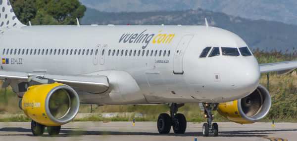 View of airplane at airport runway