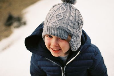 Portrait of smiling boy in snow