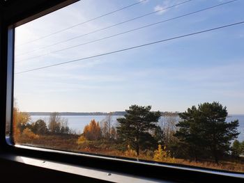 Scenic view of road seen through glass window