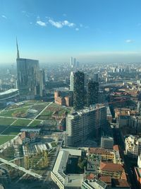 High angle view of buildings in city against sky