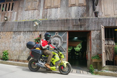 Bicycles on street against building in city