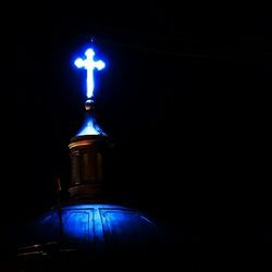 Low angle view of illuminated lamp post at night