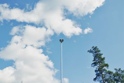 Low angle view of street light against blue sky